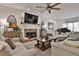 Open concept living room with fireplace and ample natural light at 314 Sandalin Ln, Peachtree City, GA 30269