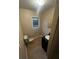 Clean bathroom with a black vanity and tile flooring at 3246 Wallace Lake Rd, Douglasville, GA 30135