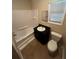 Clean bathroom with tub, toilet and vanity at 3246 Wallace Lake Rd, Douglasville, GA 30135