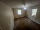 Well-lit bedroom with neutral walls and carpet at 3246 Wallace Lake Rd, Douglasville, GA 30135