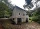 Two-story house with large windows and a partial basement at 3246 Wallace Lake Rd, Douglasville, GA 30135