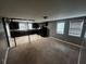Open kitchen with dark cabinetry and tile floor at 3246 Wallace Lake Rd, Douglasville, GA 30135