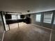 Open kitchen features dark cabinetry, tile floors, and black appliances at 3246 Wallace Lake Rd, Douglasville, GA 30135