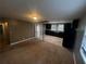 Open kitchen boasts dark cabinetry, tile floors, and black appliances at 3246 Wallace Lake Rd, Douglasville, GA 30135