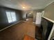 Spacious living room featuring a fireplace and an archway at 3246 Wallace Lake Rd, Douglasville, GA 30135