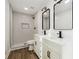 Modern bathroom featuring a double vanity, sleek fixtures, and a beautifully tiled shower at 5507 Flat Shoals Pkwy, Decatur, GA 30034