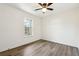 A bright bedroom with hardwood floor and natural light shining through the window at 5507 Flat Shoals Pkwy, Decatur, GA 30034