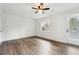 A bright bedroom with hardwood floor and natural light shining through the window and door at 5507 Flat Shoals Pkwy, Decatur, GA 30034