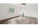 A spacious bedroom with door to outside deck and natural light shining through the window and door at 5507 Flat Shoals Pkwy, Decatur, GA 30034