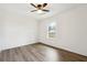 A bright bedroom with hardwood floor and natural light shining through the window at 5507 Flat Shoals Pkwy, Decatur, GA 30034
