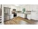 Well-lit kitchen features stainless appliances and sleek granite countertops at 5507 Flat Shoals Pkwy, Decatur, GA 30034