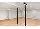 Spacious basement with hardwood floors and support beams at 1240 Spalding Dr, Sandy Springs, GA 30350