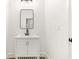 Modern bathroom with white vanity and black accents at 1240 Spalding Dr, Sandy Springs, GA 30350
