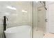 Modern bathroom with freestanding bathtub and glass shower at 1240 Spalding Dr, Sandy Springs, GA 30350