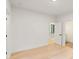Spacious bedroom with hardwood floors and access to a hall at 1240 Spalding Dr, Sandy Springs, GA 30350