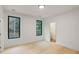 Bright bedroom with hardwood floors and large windows at 1240 Spalding Dr, Sandy Springs, GA 30350