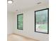 Well-lit bedroom with hardwood floors and black windows at 1240 Spalding Dr, Sandy Springs, GA 30350
