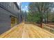 Spacious deck with wood flooring and access to backyard at 1240 Spalding Dr, Sandy Springs, GA 30350