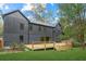 Modern home with large deck and grassy backyard at 1240 Spalding Dr, Sandy Springs, GA 30350