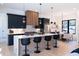 Modern kitchen with island, breakfast bar, and stainless steel appliances at 1240 Spalding Dr, Sandy Springs, GA 30350