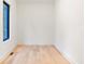 Simple office with hardwood floors and a large window at 1240 Spalding Dr, Sandy Springs, GA 30350
