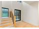 Modern staircase with metal railing and light wood steps at 1240 Spalding Dr, Sandy Springs, GA 30350