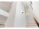 Bright, open staircase with modern light fixtures at 1240 Spalding Dr, Sandy Springs, GA 30350