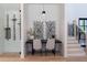 Small wine cellar with glass door and built-in shelving at 1240 Spalding Dr, Sandy Springs, GA 30350