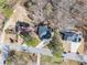 Aerial view of a neighborhood with tree-lined streets showcasing home exteriors and landscaping at 1350 Eryn Cir, Suwanee, GA 30024