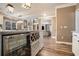 Kitchen bar with wine cooler and view to other areas in the home at 1350 Eryn Cir, Suwanee, GA 30024