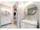 Elegant bathroom featuring a double vanity with marble countertops and gold fixtures at 1350 Eryn Cir, Suwanee, GA 30024