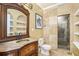 Bathroom features marble countertop, vanity mirror, and tiled walk-in shower at 1350 Eryn Cir, Suwanee, GA 30024