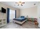 Bright bedroom with wood-look flooring, a large window, and themed decorations at 1350 Eryn Cir, Suwanee, GA 30024