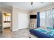 Spacious bedroom with ensuite bath, wood-look floors, and plenty of natural light at 1350 Eryn Cir, Suwanee, GA 30024