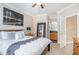 Spacious bedroom with ensuite bath, neutral walls, and carpeted floor at 1350 Eryn Cir, Suwanee, GA 30024