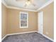 Neutral bedroom with ceiling fan, window, carpeting, and white trim at 1350 Eryn Cir, Suwanee, GA 30024
