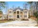 Beautiful two-story home with a classic design, landscaped front yard and a spacious driveway at 1350 Eryn Cir, Suwanee, GA 30024