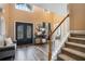 Grand foyer featuring soaring ceilings, double doors, and stairs leading to upper level at 1350 Eryn Cir, Suwanee, GA 30024