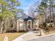 Elegant home with a grand entrance, pillared facade, and well-manicured lawn at 1350 Eryn Cir, Suwanee, GA 30024