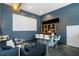 Entertainment room features a wet bar, multiple TV screens, and lounge seating at 1350 Eryn Cir, Suwanee, GA 30024
