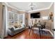 Functional home office features large windows, comfortable seating, and ample workspace at 1350 Eryn Cir, Suwanee, GA 30024