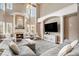 Bright and airy living room features a fireplace, high ceilings, and comfortable seating area at 1350 Eryn Cir, Suwanee, GA 30024