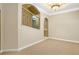 Spacious living room features neutral carpet, beige walls, and white crown molding at 1350 Eryn Cir, Suwanee, GA 30024