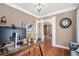 Spacious office with wood floors, large computer screen, and view to hallway at 1350 Eryn Cir, Suwanee, GA 30024