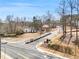 Street view of the home in a quiet neighborhood with landscaped lawns and mature trees at 1350 Eryn Cir, Suwanee, GA 30024