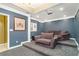 Home theater room features tiered seating, projector, and cozy furnishings at 1350 Eryn Cir, Suwanee, GA 30024