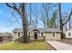 Charming single-story home with a cozy front porch and mature trees in the front yard at 884 Custer Se Ave, Atlanta, GA 30316