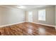 Inviting living room featuring wood flooring, natural light, and white trim accents at 884 Custer Se Ave, Atlanta, GA 30316