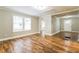 Bright living room featuring gleaming hardwood floors and ample natural light through the windows at 884 Custer Se Ave, Atlanta, GA 30316
