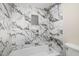 Updated bathroom with marble-look tile and shower/tub combo at 18 Ivy Ne Rdg, Atlanta, GA 30342